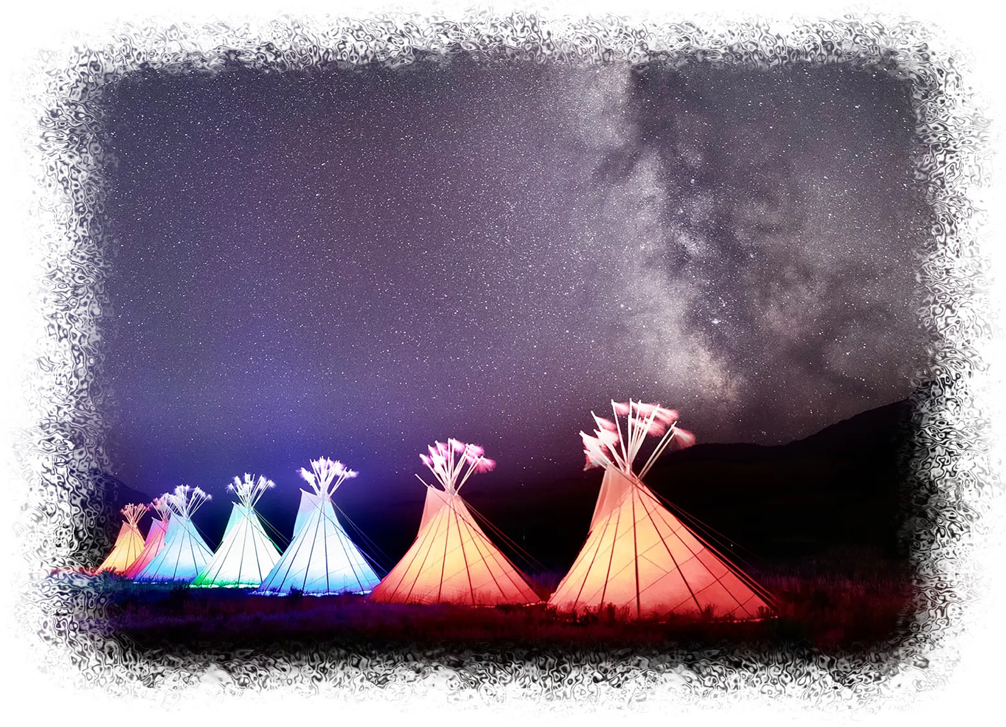 Tipis at night in Yellowstone - NPS Photo